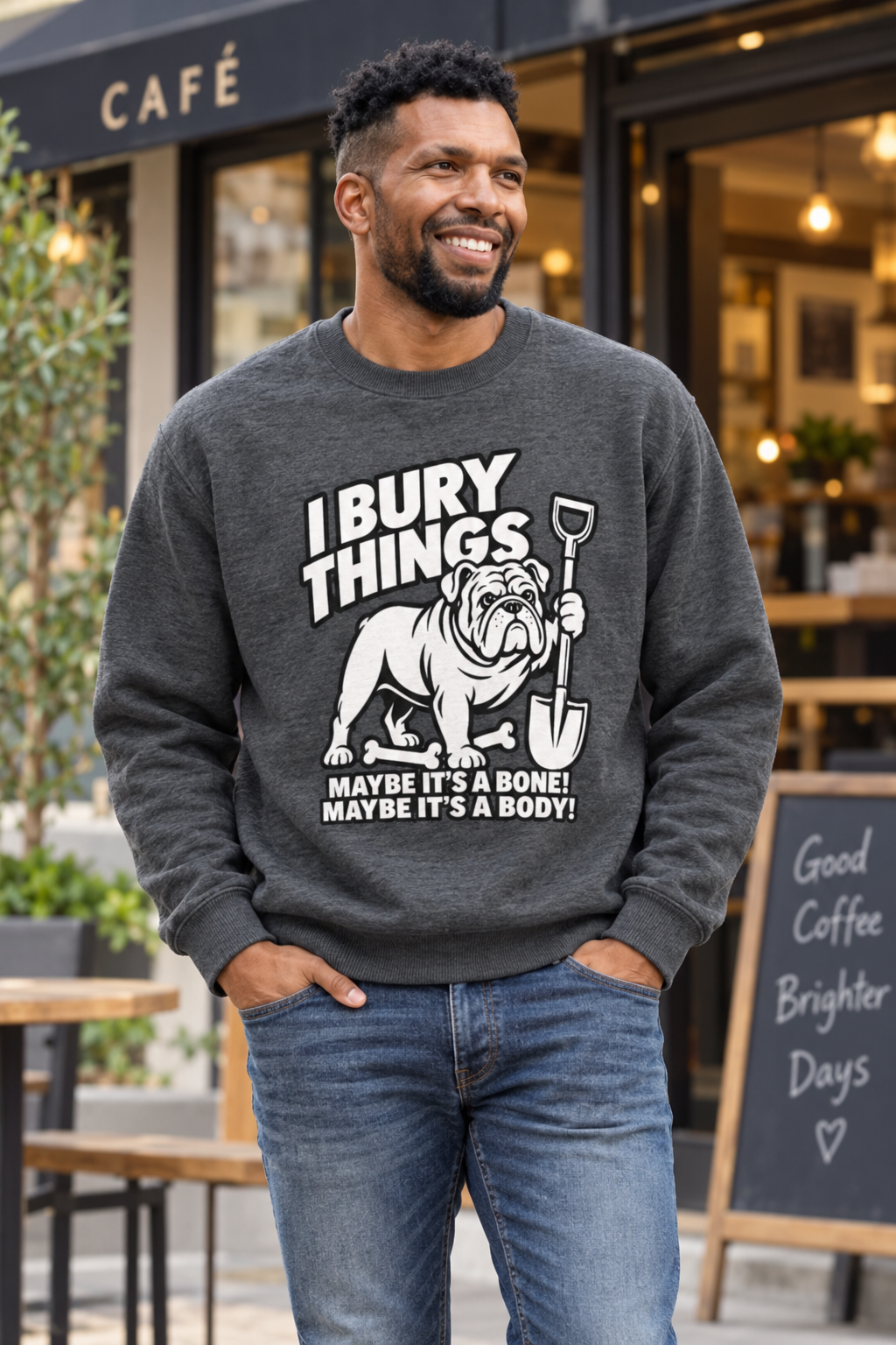 Charcoal I Bury Things bulldog knitted crew-neck jumper worn outside a local cafe